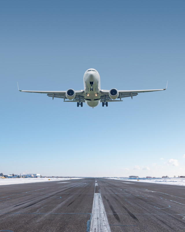 White Passenger Jet Plane Take Off Airport Runway At Winter